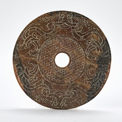 Lot 51 - A Chinese Jade Archaistic Bi Disc