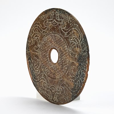 Lot 51 - A Chinese Jade Archaistic Bi Disc