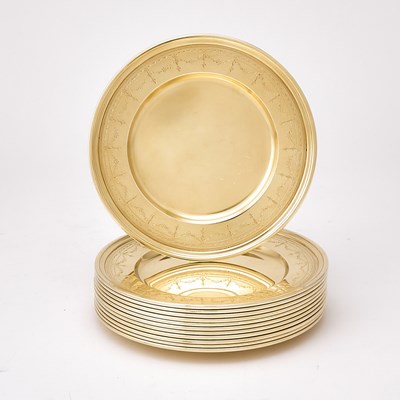 Lot 41 - Set of Twelve Tiffany & Co. Sterling Silver-Gilt Bread Plates