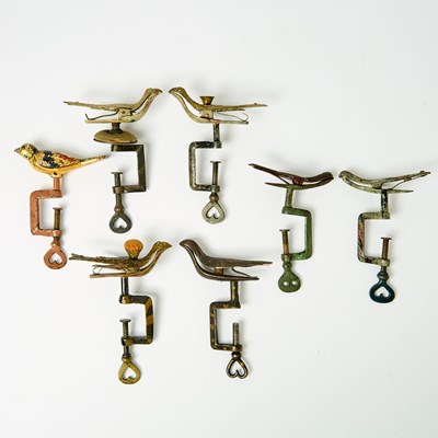 Lot 1029 - Seven Painted Bird Sewing Clamps