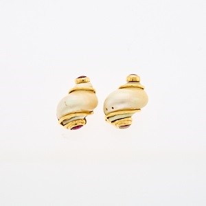 Lot 1148 - Seaman Schepps Pair of Gold, Shell and Cabochon Ruby 'Small Turbo Shell' Earclip Fragments