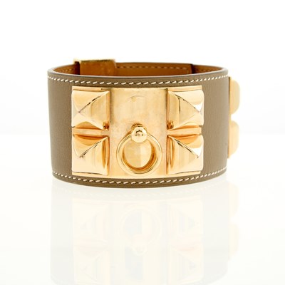 Lot 2025 - Hermès Etoupe Leather and Gold-Tone Metal 'Collier de Chien' Cuff Bracelet