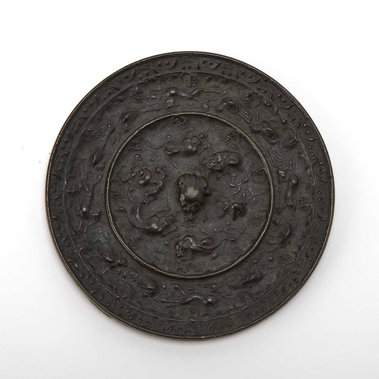 Lot 63 - A Chinese Bronze Mirror
