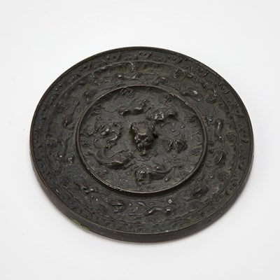Lot 63 - A Chinese Bronze Mirror