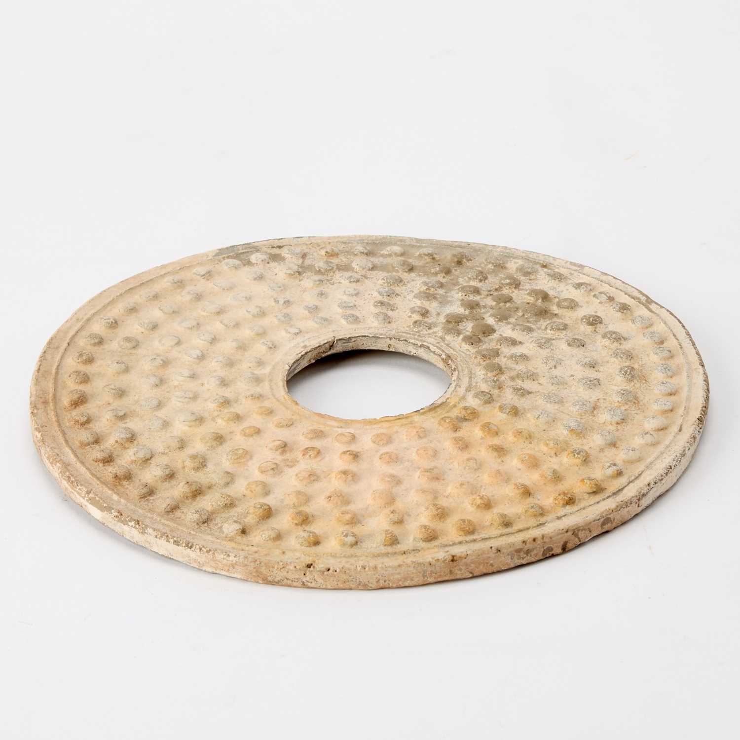 Lot 35 - A Chinese Archaistic Carved Jade Bi Disc