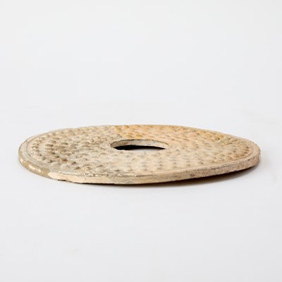 Lot 35 - A Chinese Archaistic Carved Jade Bi Disc