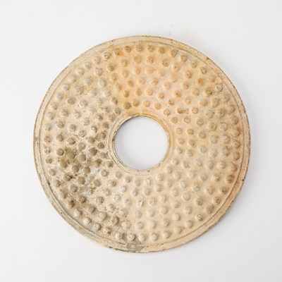 Lot 35 - A Chinese Archaistic Carved Jade Bi Disc