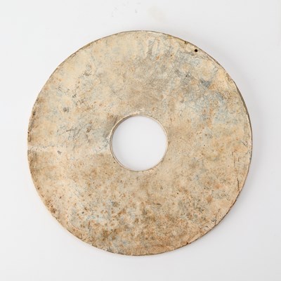 Lot 35 - A Chinese Archaistic Carved Jade Bi Disc