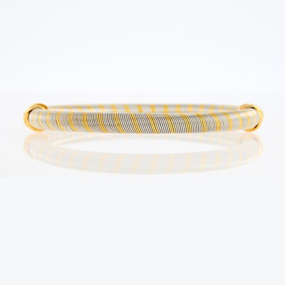 Lot 1001 - Cartier Stainless Steel and Two-Color Gold 'Trinity' Bangle Bracelet