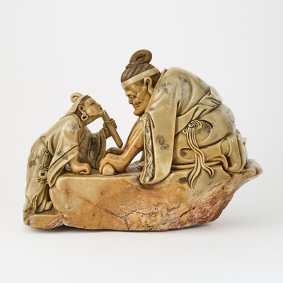 Lot 613 - A Chinese Soapstone Carving of Two Seated Figures on a Rock