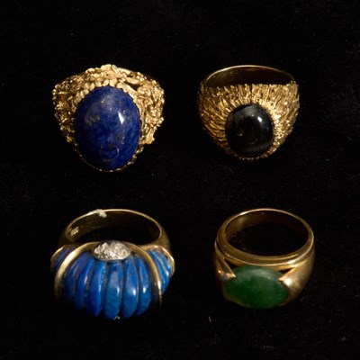 Lot 366 - Four 14KT Gold, Nephrite, Lapis and Black Star Sapphire Rings