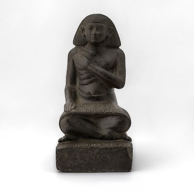 Lot 181 - Egyptian Style Cast Composition Faux Stone Figure of a Seated Scribe After the Antique