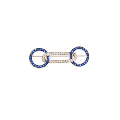 Lot 1127 - Tiffany & Co. Platinum, Sapphire and Diamond Interlocking Brooch