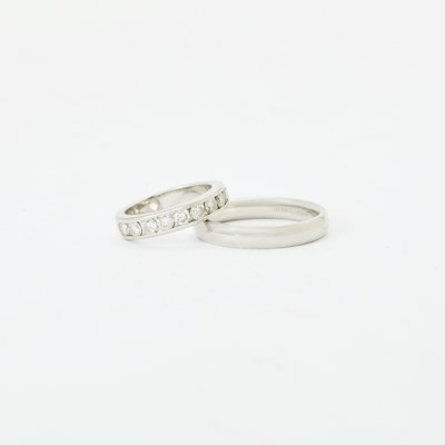 Lot 74 - Two Platinum and Diamond Band Rings