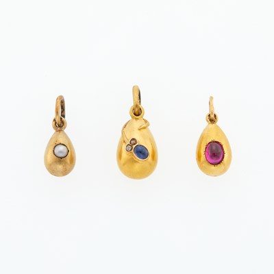 Lot 223 - Group of Three Russian Jeweled Gold Egg Pendants