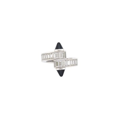 Lot 138 - Cartier White Gold, Diamond and Black Onyx 'Menotte' Crossover Ring, France