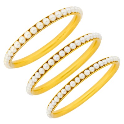 Lot 77 - Three Gold and Cultured Pearl Bangle Bracelets