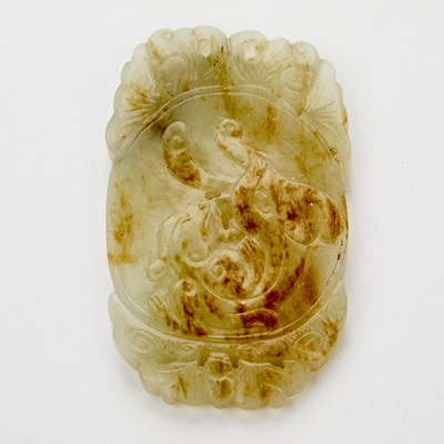 Lot 451 - A Chinese Pebbled White Jade Oval Plaque