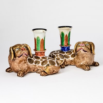 Lot 224 - A Mirrored Pair of Chinese Enameled Porcelain Fu Dog Candle Holders