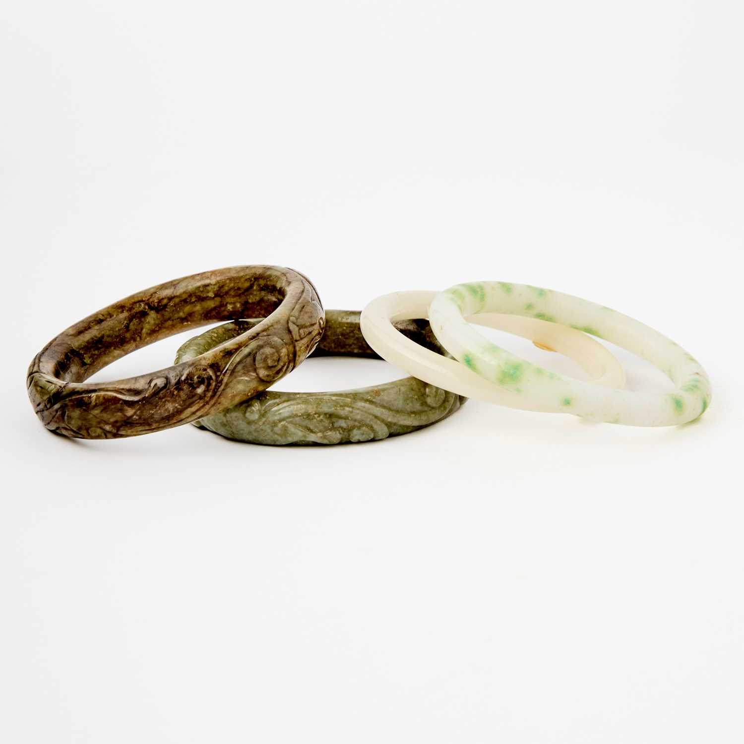Lot 27 - A Group of Four Chinese Jade Bangles