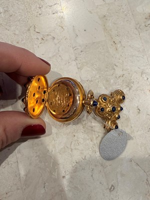 Lot 1159 - Marcus & Co. Gold, and Cabochon Sapphire Pendant-Watch