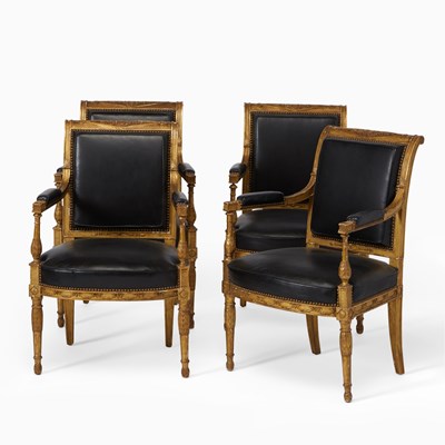 Lot 356 - Set of Four Directoire Leather-Upholstered Carved and Giltwood Fauteuils