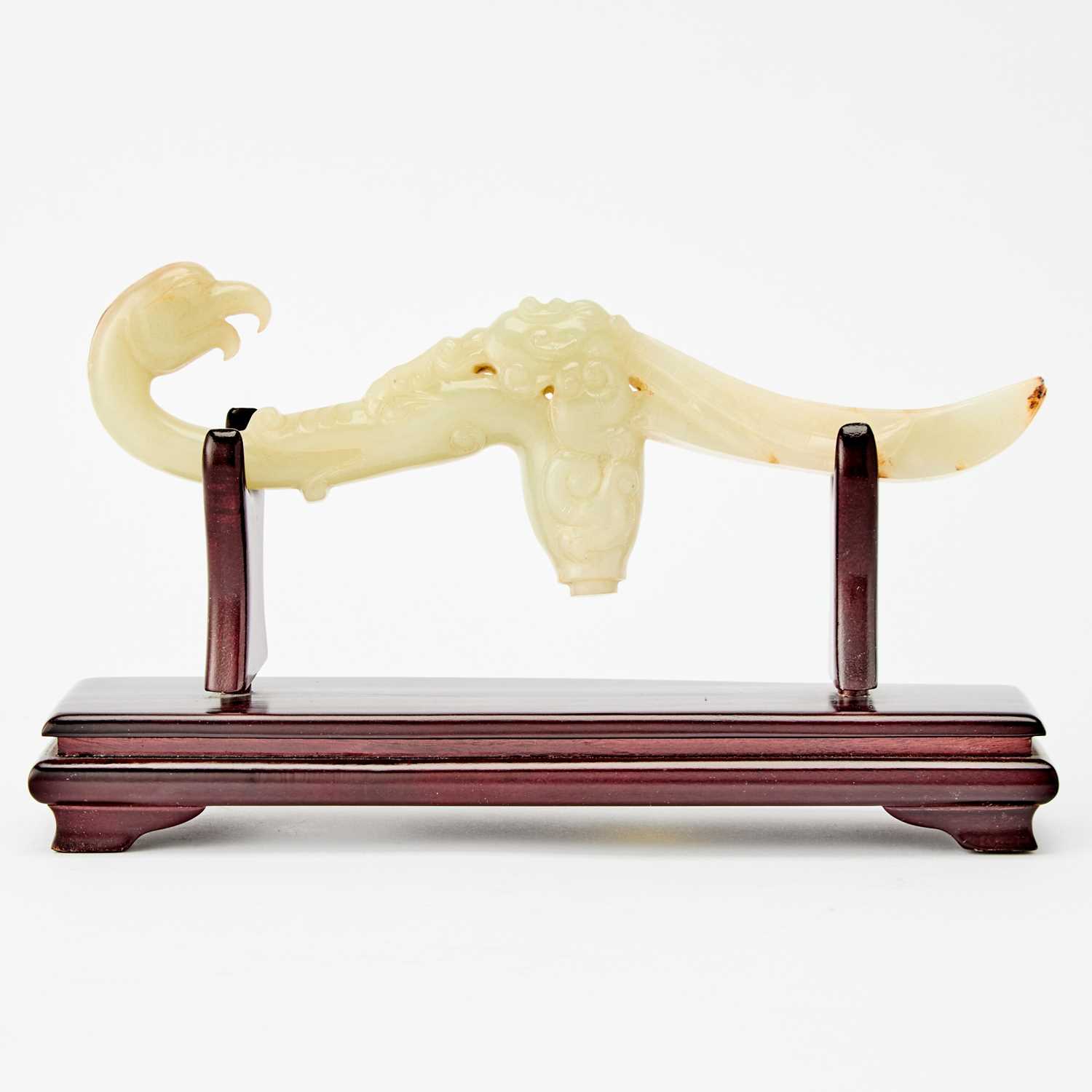 Lot 30 - A Chinese Carved Celadon Jade Handle