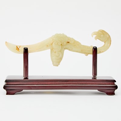 Lot 30 - A Chinese Carved Celadon Jade Handle