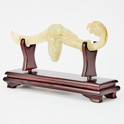 Lot 30 - A Chinese Carved Celadon Jade Handle