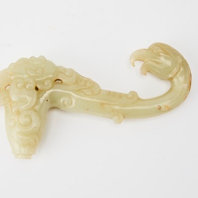 Lot 30 - A Chinese Carved Celadon Jade Handle