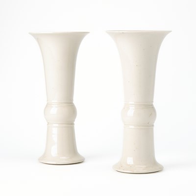 Lot 529 - A Pair of Chinese White Glazed Porcelain Gu Vases