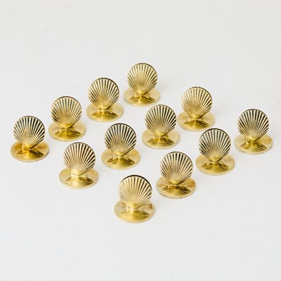 Lot 130 - Set of Twelve Tiffany & Co. Sterling Silver-Gilt Shell-Form Place Card Holders