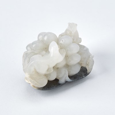 Lot 41 - A Chinese White and Grey Jade 'Squirrel and Grapes' Group