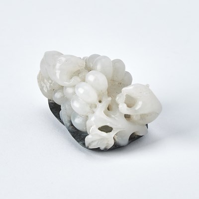 Lot 41 - A Chinese White and Grey Jade 'Squirrel and Grapes' Group
