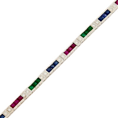 Lot 1057 - White Gold, Ruby, Emerald, Sapphire and Diamond Bracelet