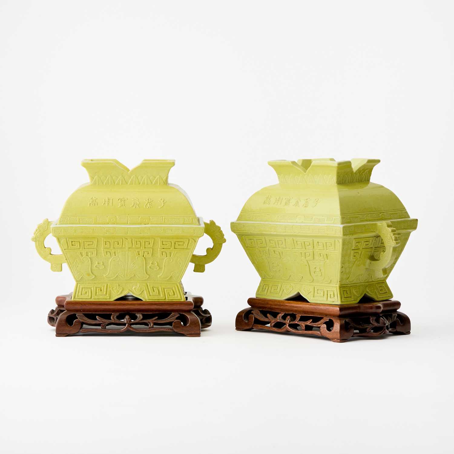 Lot 75 - A Pair of Chinese Yellow Glazed Porcelain Archaistic Vessels and Covers