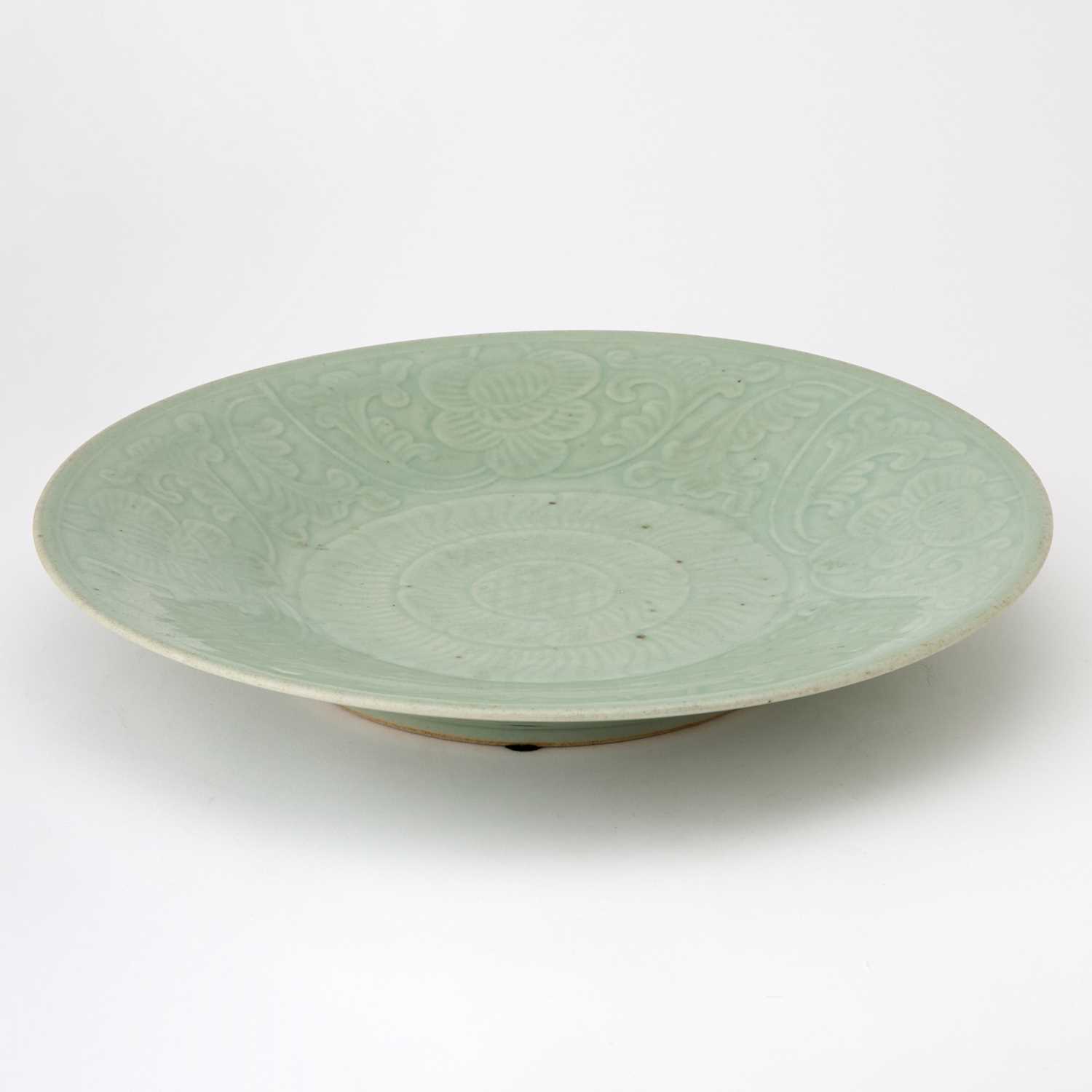 Lot 95 - A Chinese Celadon Glazed Carved Porcelain Charger
