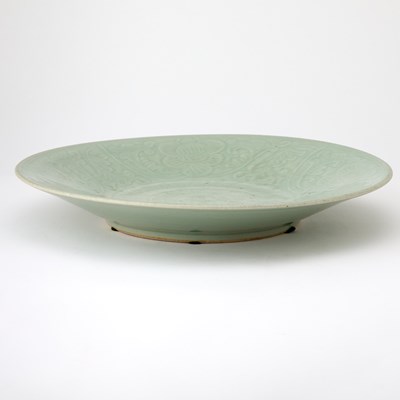 Lot 95 - A Chinese Celadon Glazed Carved Porcelain Charger