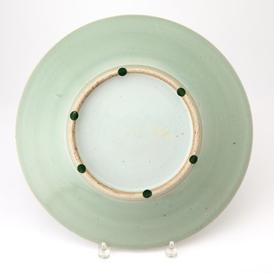 Lot 95 - A Chinese Celadon Glazed Carved Porcelain Charger