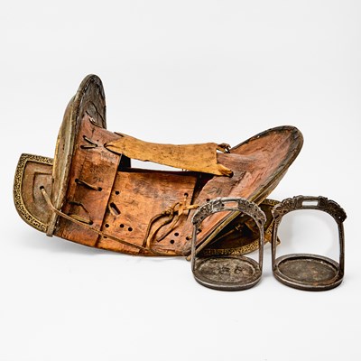 Lot 310 - A Tibetan Gilded Iron and Lacquered Wood Saddle