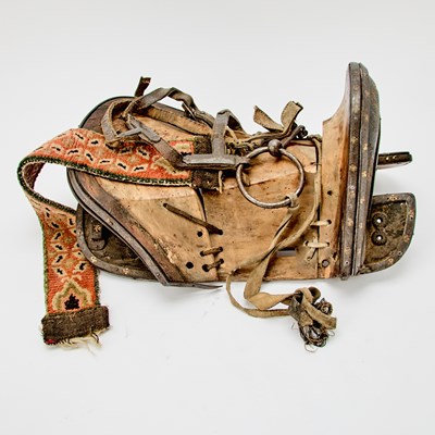 Lot 312 - A Tibetan Wood, Inlaid Iron, and Shagreen Saddle