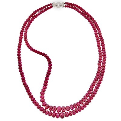 Lot 1245 - Double Strand Ruby Bead Necklace with White Gold and Diamond Clasp