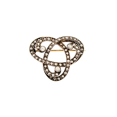 Lot 1190 - Silver, Gold and Diamond Celtic Knot Pendant-Brooch