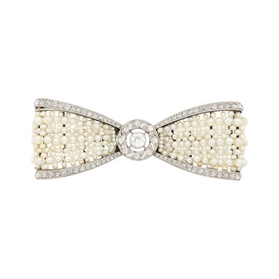 Lot 189 - Cartier Paris Belle Époque Platinum, Seed Pearl and Diamond Bow Brooch