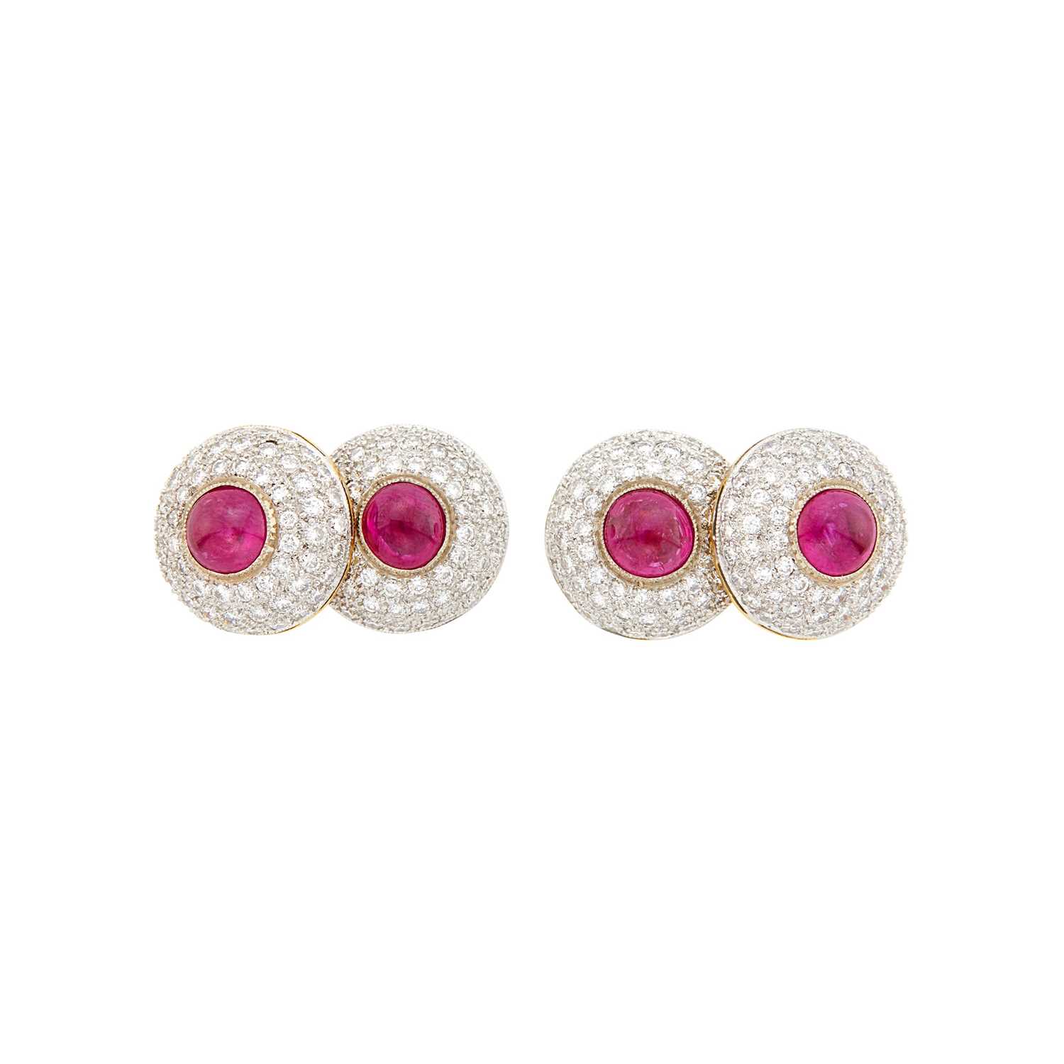 Lot 1082 - Pair of Two-Color Gold, Cabochon Ruby and Diamond Cufflinks