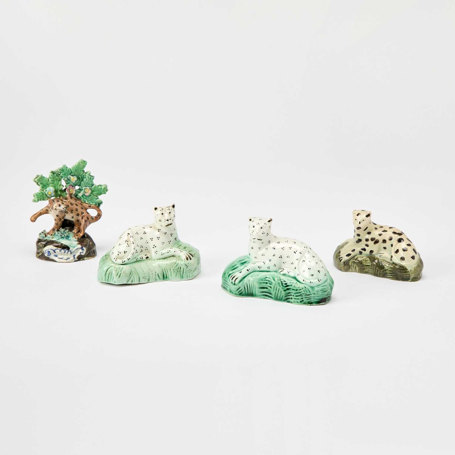 Lot 99 - Four English Pottery Figures of Leopards