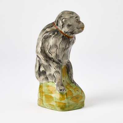 Lot 87 - Staffordshire Figure of a Seated Monkey