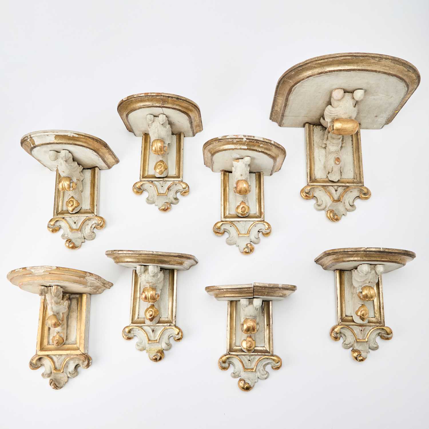 Lot 154 - Group of Eight Baroque Style White Painted and Gilt Brackets