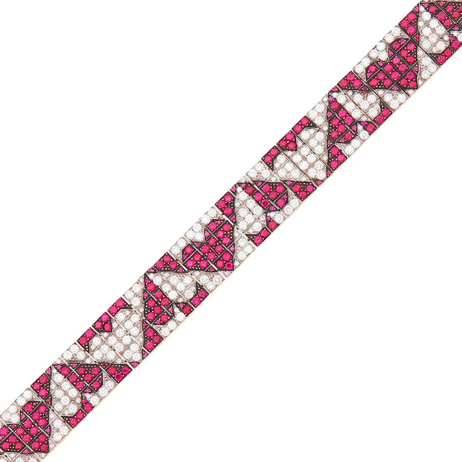 Lot 1101 - Enigma Tricolor Gold, Ruby and Diamond Heart Bracelet