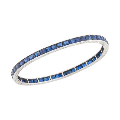 Lot 86 - Platinum and Sapphire Bangle Bracelet